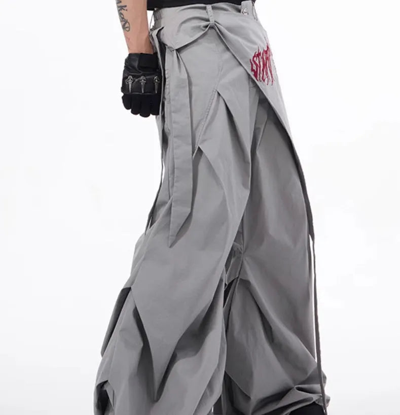 Boy wearing black wide-leg Korean style summer trousers with an elasticated waistband.