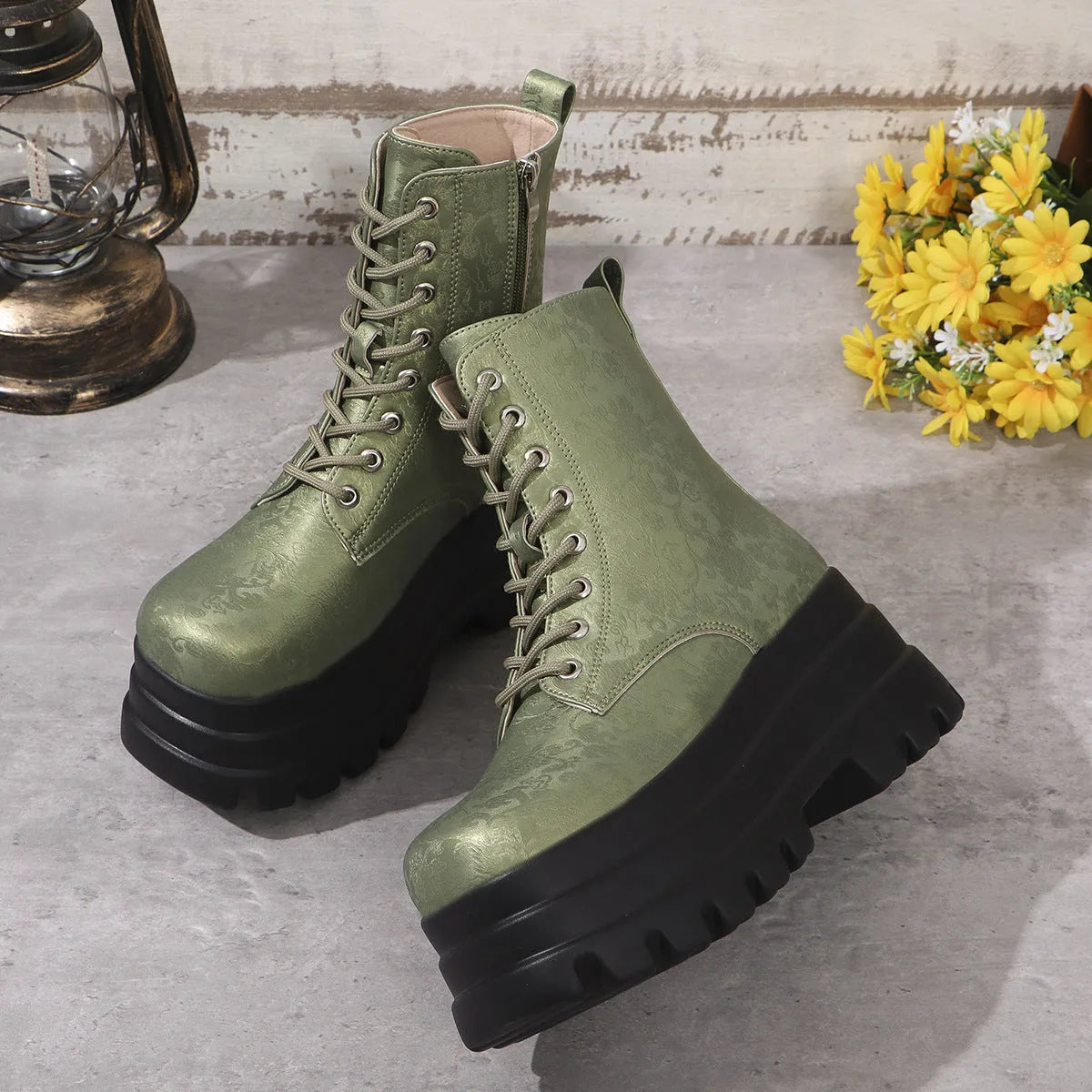 Women's black retro platform Martin boots with chunky heel and side zipper detail.