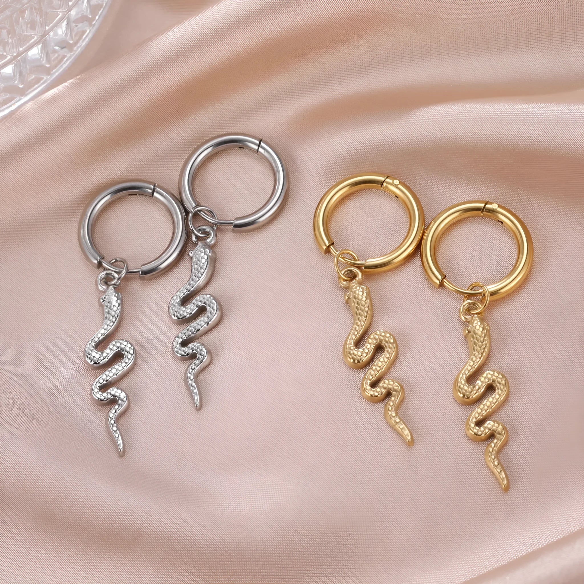 Gold plated stainless steel snake-shaped vintage earrings with ear clip fastening