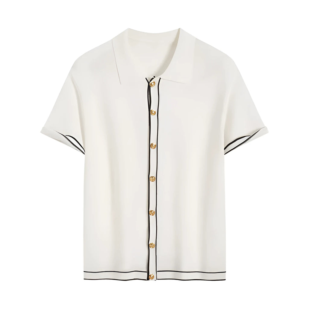 White short sleeve cardigan with dark contrast lapels laid flat.