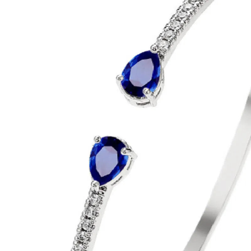 Multi-zircon bracelet with inlaid design on copper material in white or blue colour