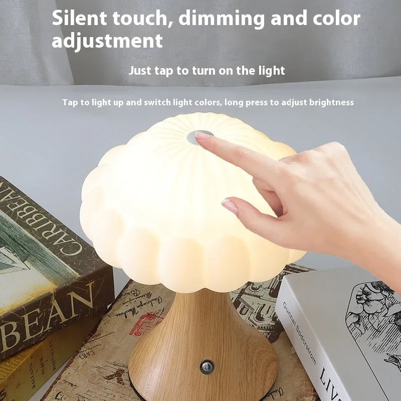 Creative mushroom-shaped night lamp in wood grain colour on a table