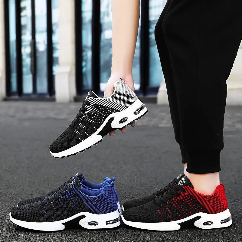 Men's black and grey Flyknit mesh low-top casual sneakers with lace-up front and soft sole.