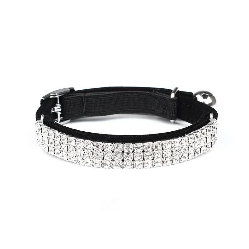 Adjustable velvet cat collar with rhinestones in red, blue, purple, black, or pink.