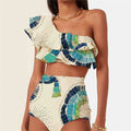White women's one-shoulder swimsuit with large lotus leaf detail and split design