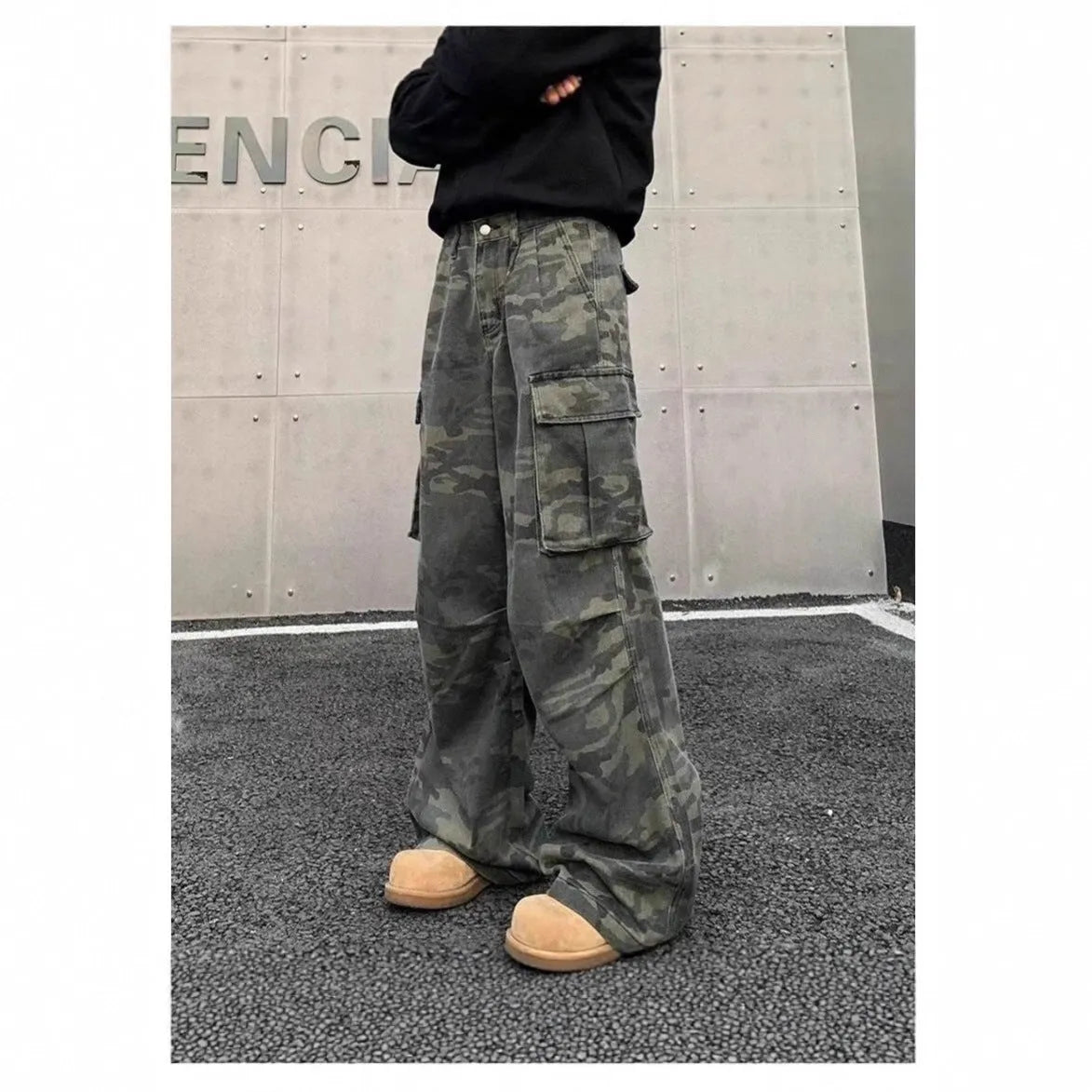 Cotton blend cargo trousers with washed camouflage print and multiple pockets.