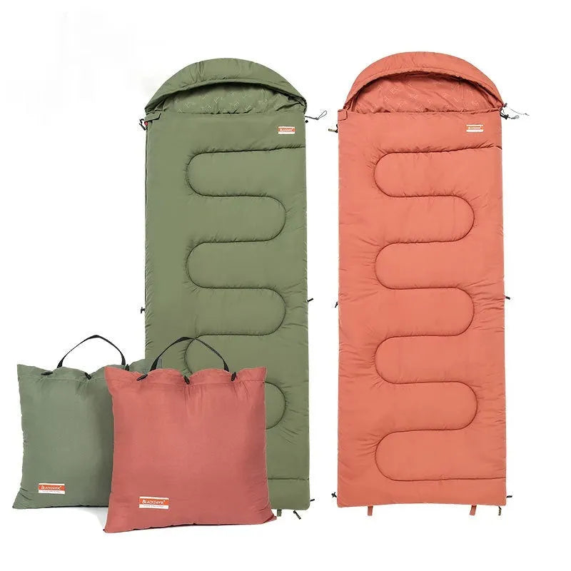 Ochre and olive green cotton sleeping bag quilt laid out flat, showing its quilted texture and portable size.