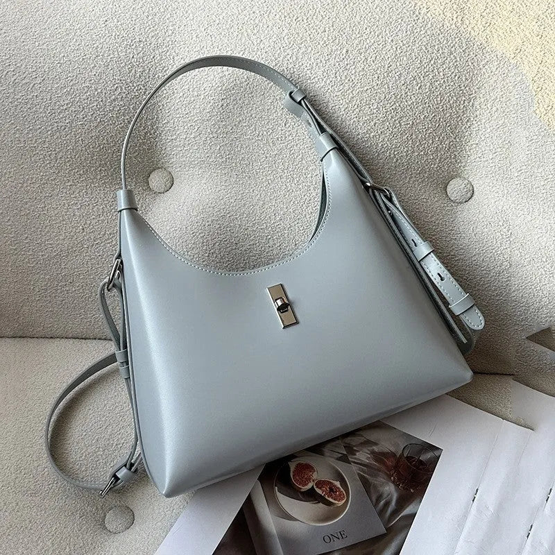 Genuine cowhide leather crossbody shoulder bag in dumpling shape with sandwich pocket and six colour options