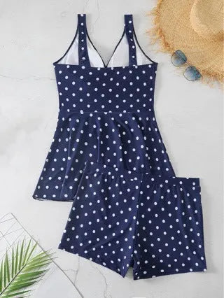 Blue polka dot print women's plus size two-piece swimsuit with bikini briefs style.