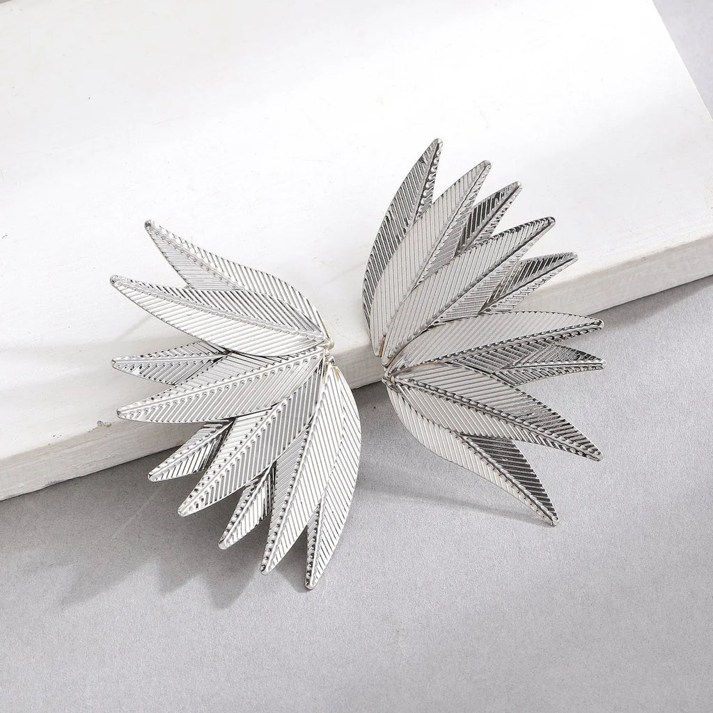 Alloy metal leaf-shaped patch earrings in white and gold colour options