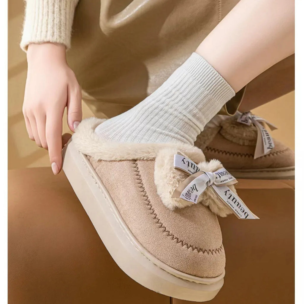 Women's beige suede half slippers with a ribbon bow and thick EVA sole.
