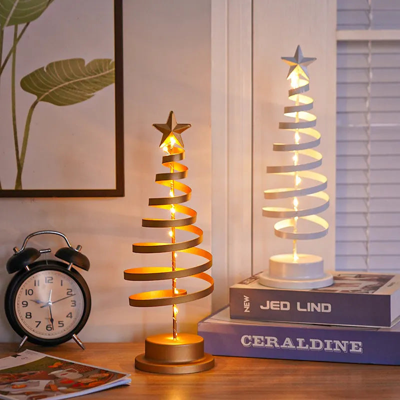 33cm tall metal LED Christmas tree ornament with warm white lights on tabletop