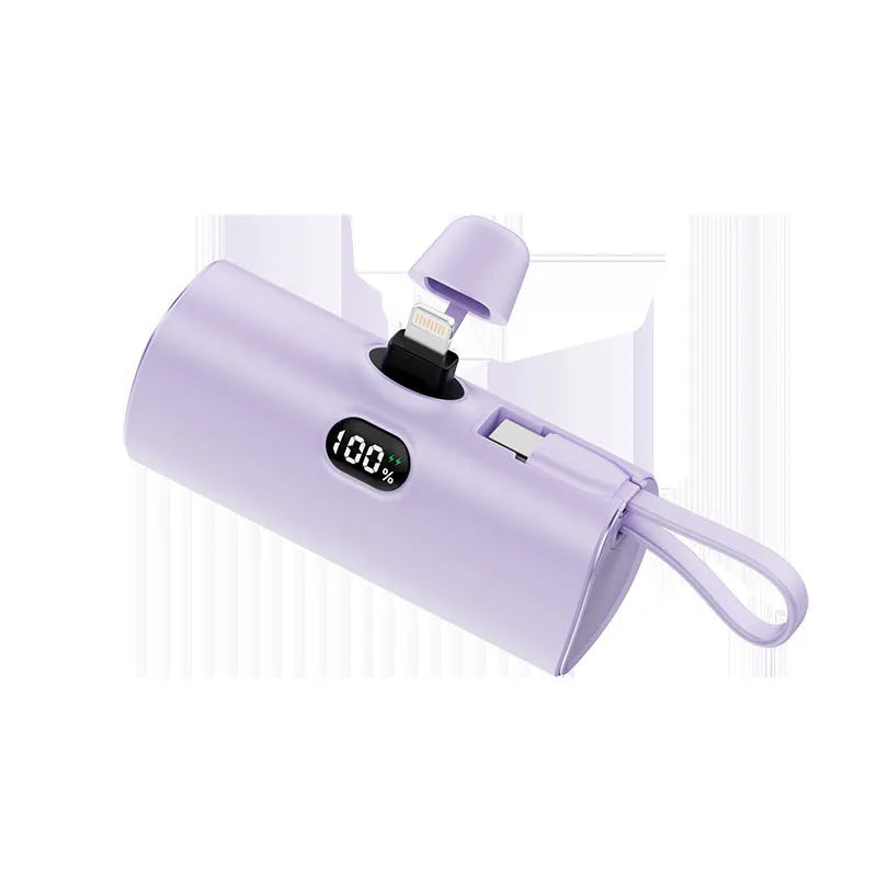 Compact capsule‑shaped digital display power bank with integrated plug, shown in multiple colours.