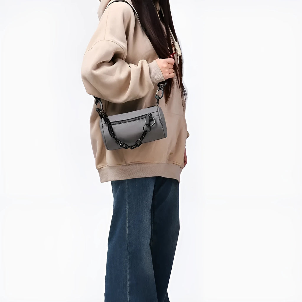 Oxford cloth crossbody messenger bag with chain details in black, grey, or orange colour.