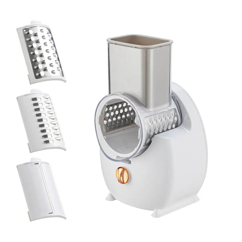 White electric vegetable slicer with suction base and multiple blades for grating and chopping.