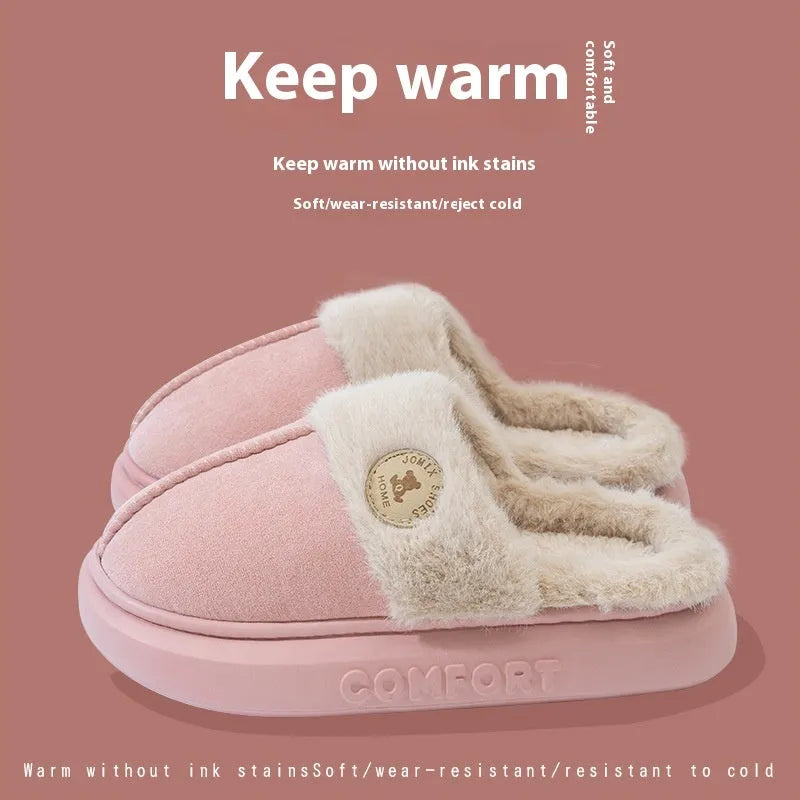 Pair of thick-soled fleece indoor slippers in a chosen colour, showing car stitching detail on the upper.