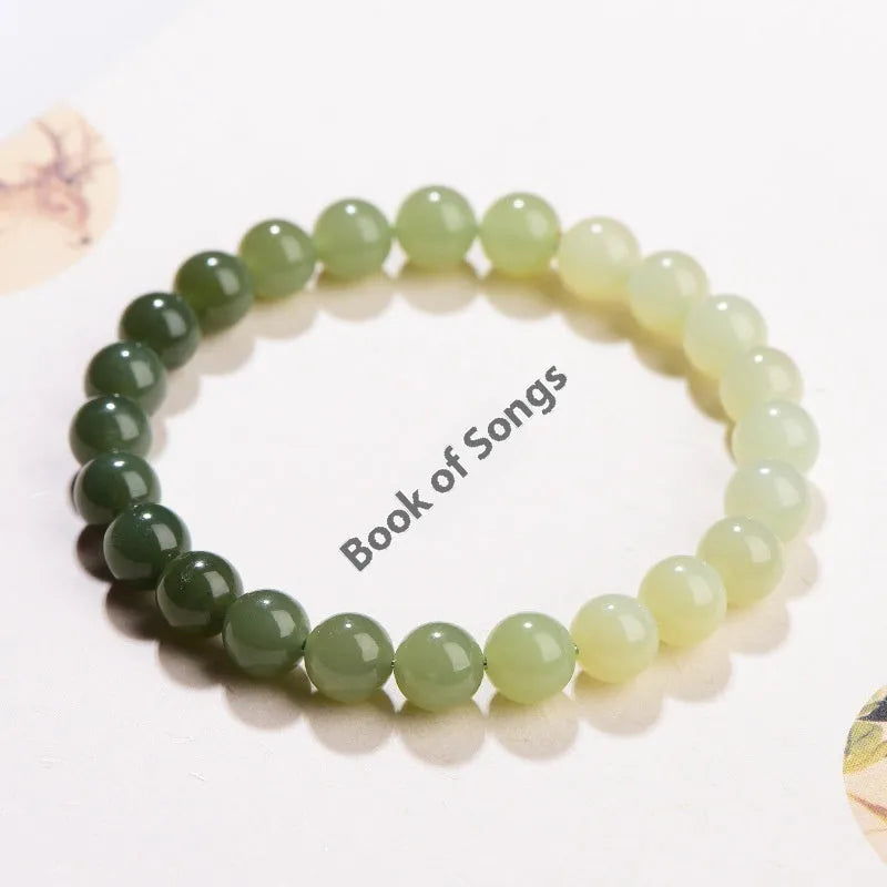 Natural clear water Hetian jade bracelet with gradient colour beads in round or barrel styles.