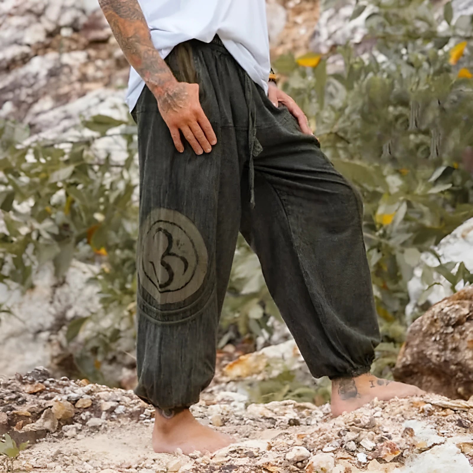 Dark green men's trousers with ethnic pattern and ankle tie detail, mid waist fit