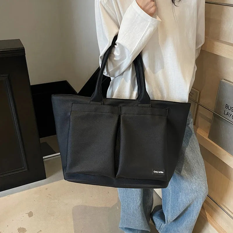 Lightweight PU shoulder bag in solid colour with ventilation, shown in black, green, or white.