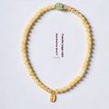Women's Topaz bracelet with six-word mantra barrel beads and square sugar jade beads
