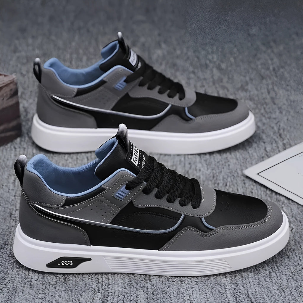 Men's solid colour canvas board shoes with leather stitching and a low-top design.