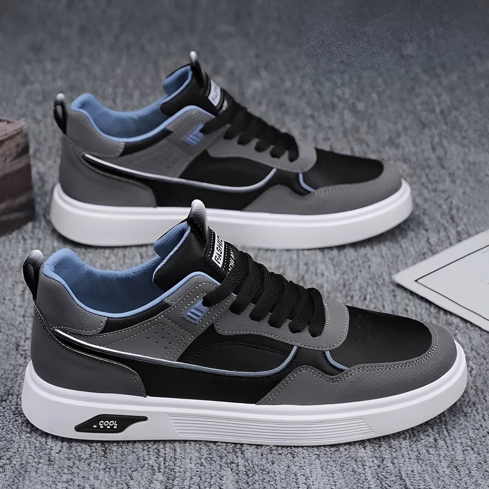 Men's solid colour canvas board shoes with leather stitching and a low-top design.