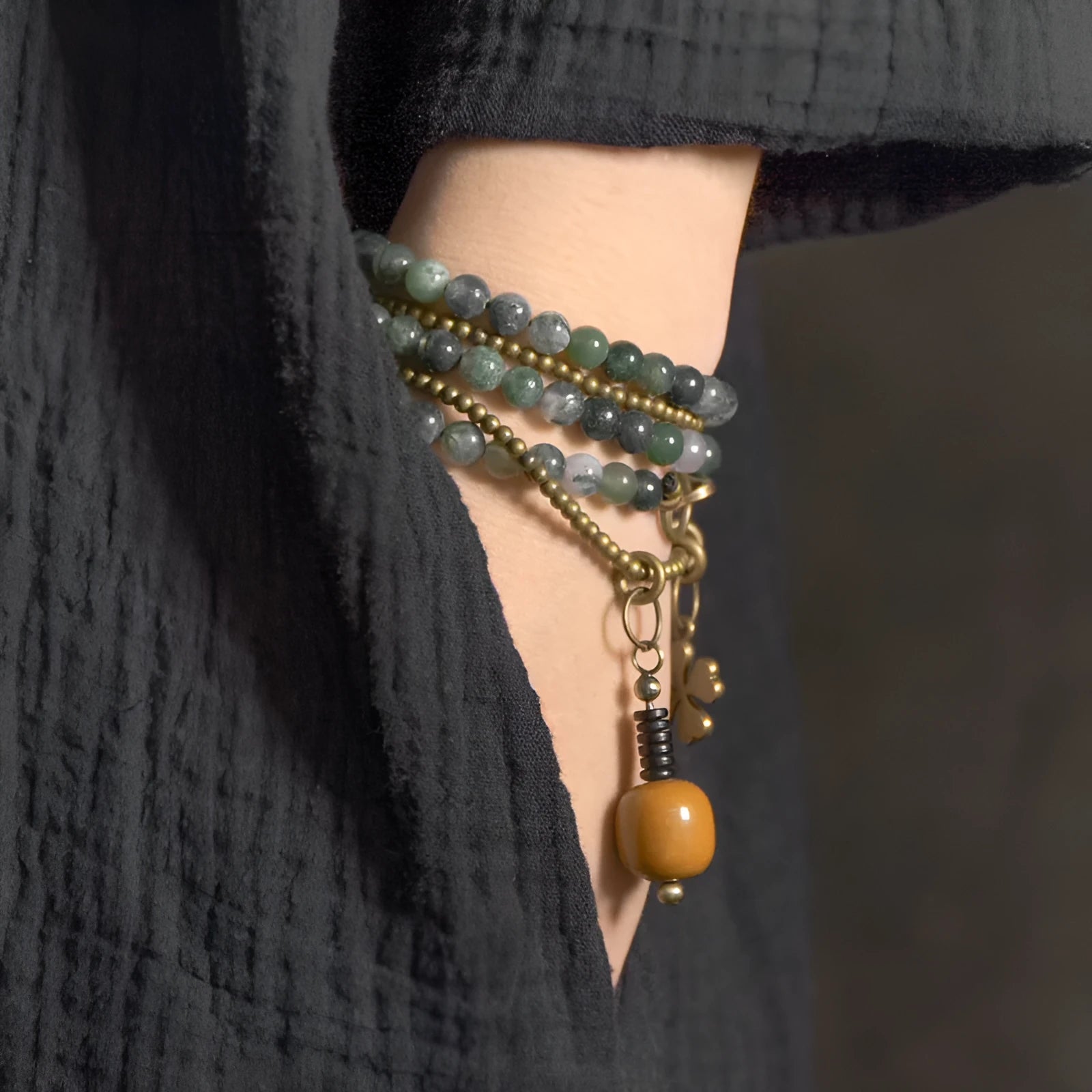 Handmade multi-layered ethnic style children's bracelet in natural crystal or stone, shown in sizes for boys and girls.