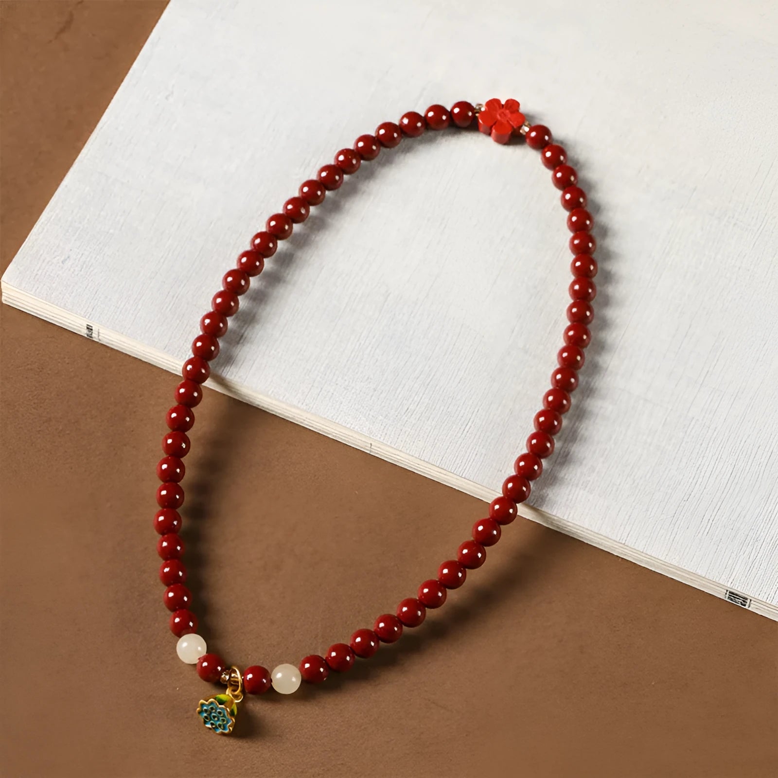 Hand-woven double circle bracelet with purple gold cinnabar beads and lotus design
