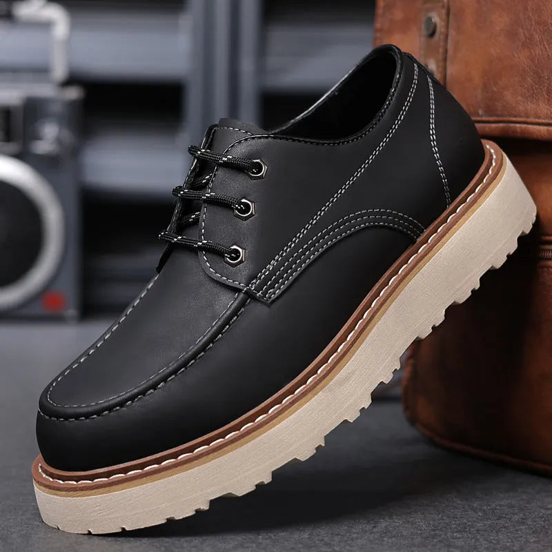 Men's black retro low-top Martin boots with a round toe and rubber sole on a white background