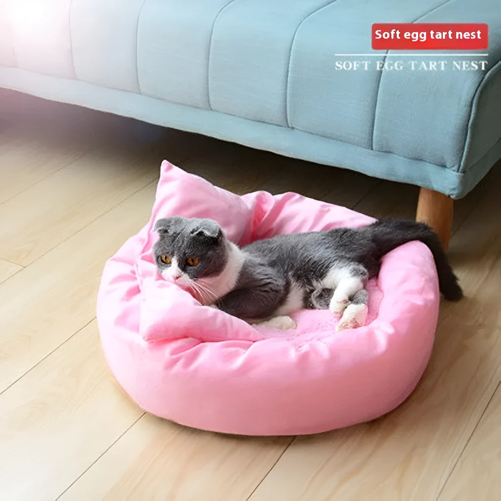 Soft light grey cotton-filled dog bed for a small dog, showing cloth material and round shape.