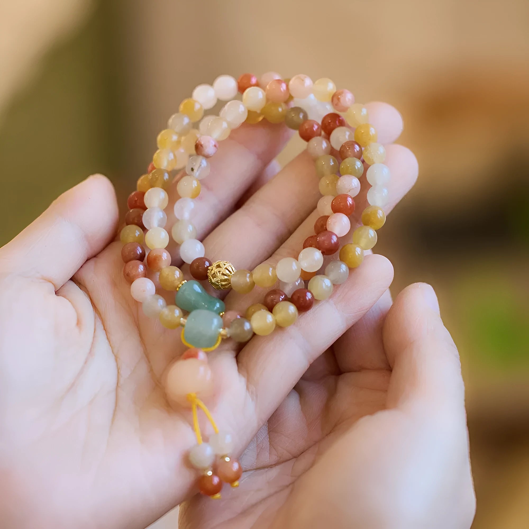 Women's handcrafted three-circle pumpkin jade bracelet with gold tassels