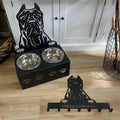 Personalised ceramic dog bowl on a stainless steel stand with custom name and iron dog head decoration.