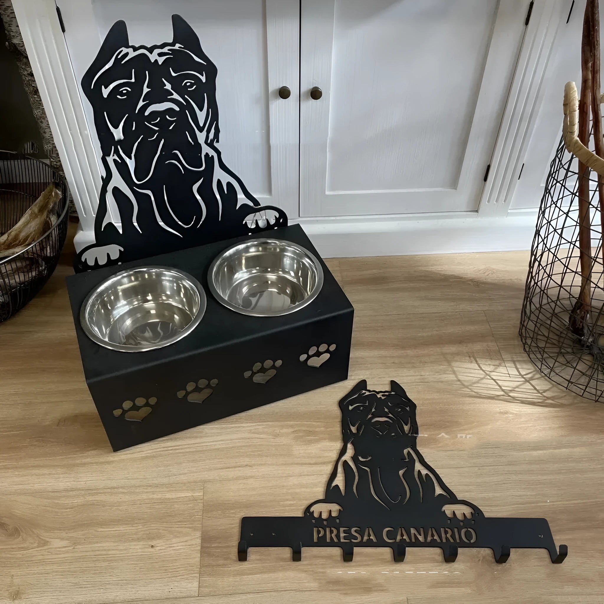 Personalised ceramic dog bowl on a stainless steel stand with custom name and iron dog head decoration.