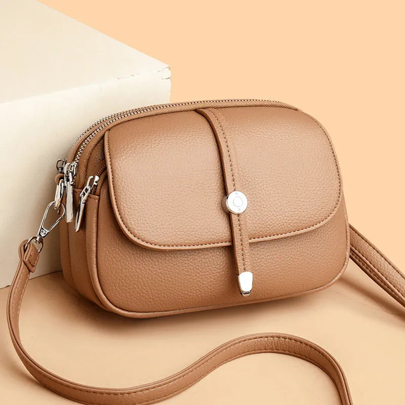 City Simple women's oval crossbody bag in soft PU leather available in black, khaki, or dark brown