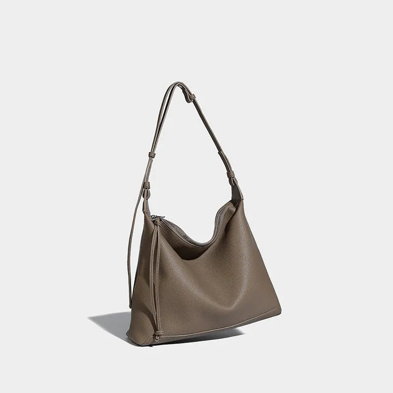 Soft PU messenger bag in caramel colour showing 36cm length and underarm shoulder strap
