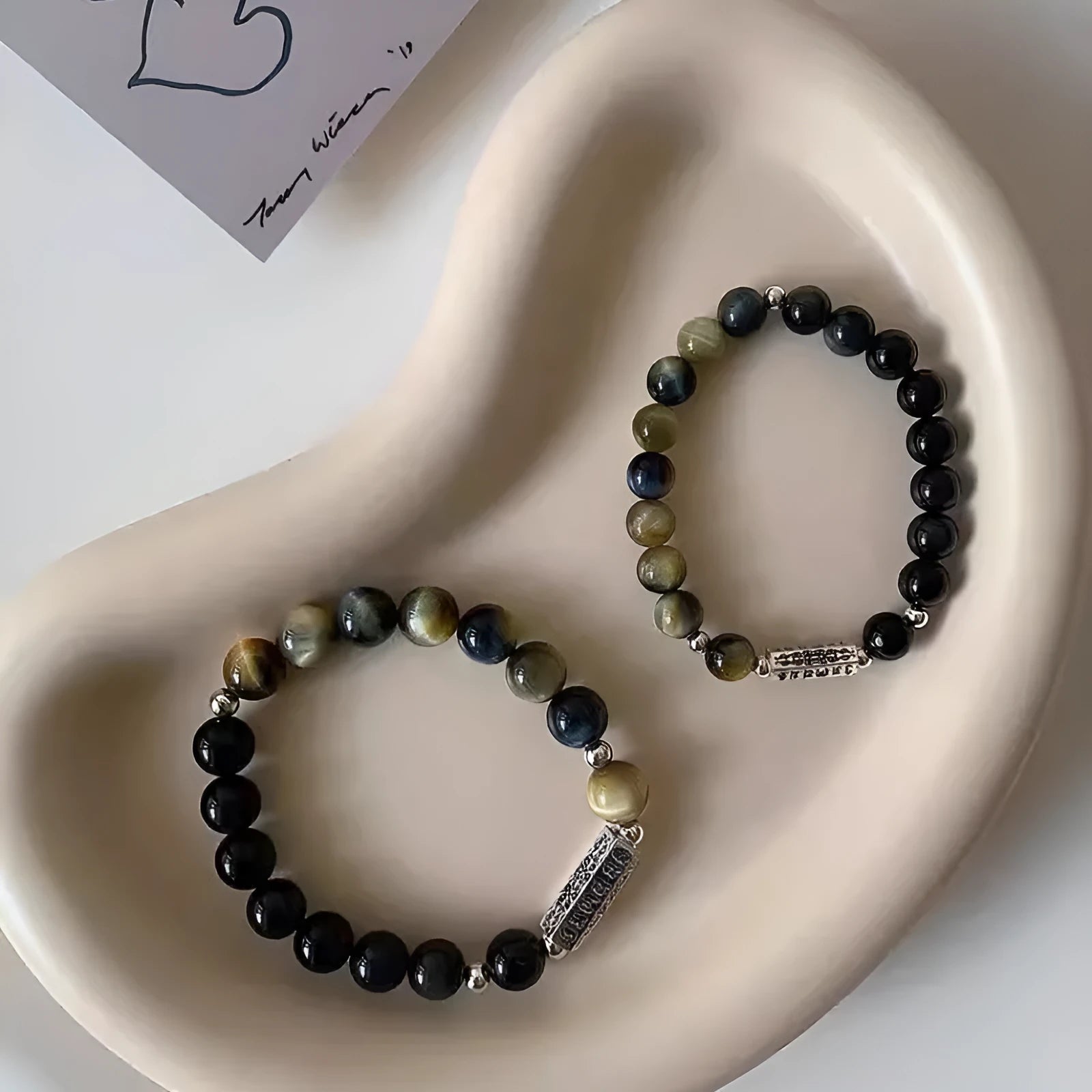 Sterling silver bracelet with obsidian and tigereye round beads featuring six words mantra Chinese design