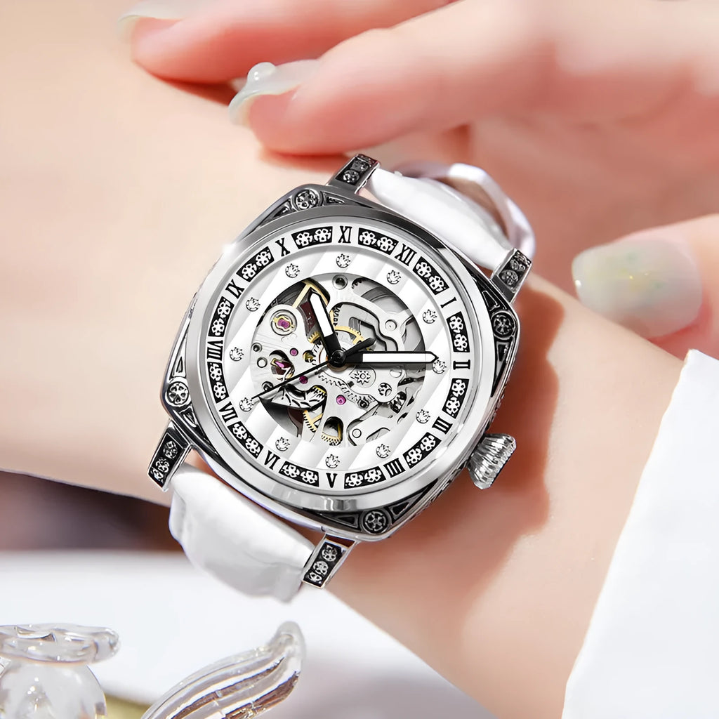 Mechanical wristwatch with luminous dial on a leather strap, shown in multiple colour options.