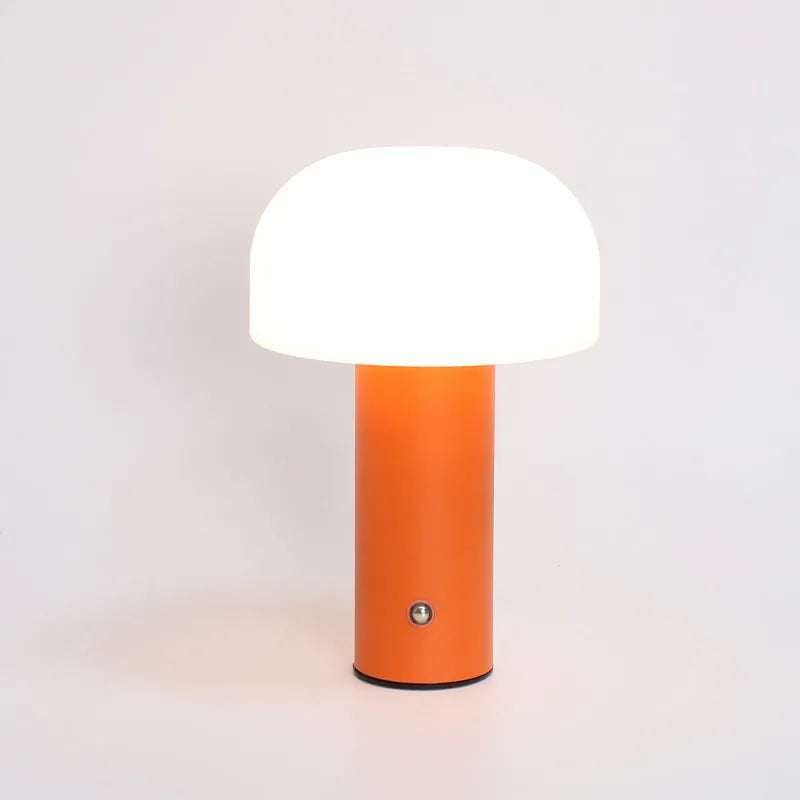 USB-powered plastic table lamp in choice of black, green, orange, or white colours.