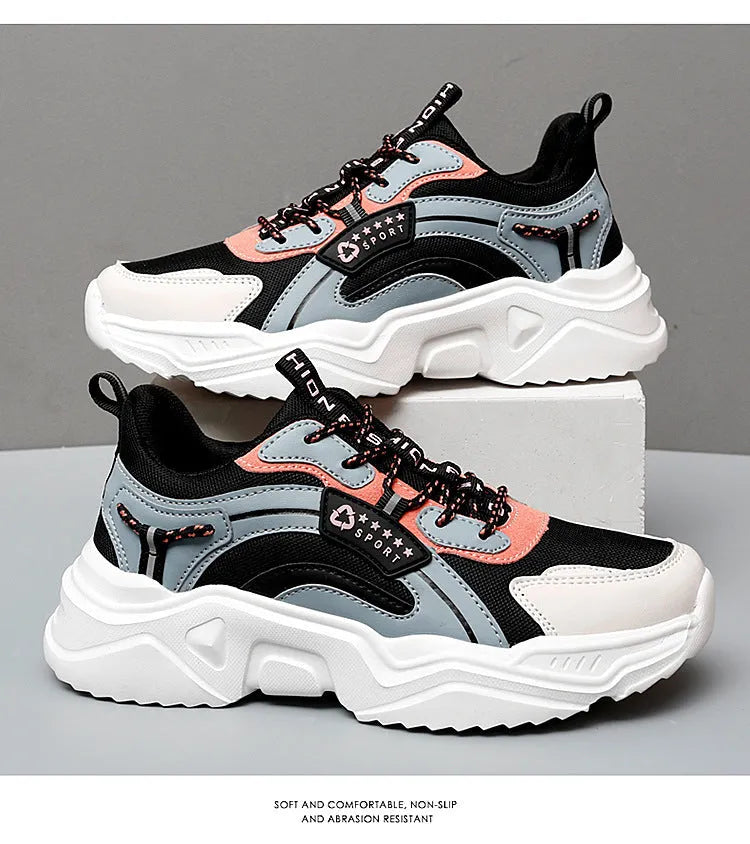 White women's casual sports shoes with mesh upper, thick PU sole, round toe, and a buckle strap.