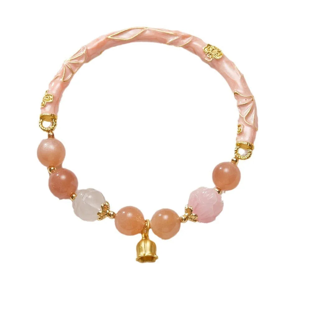Chinese style sunstone jade bracelet with lily pattern and geometric gold thread design