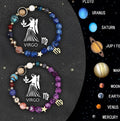 Set of two natural stone beaded bracelets with zodiac sign designs laid flat.