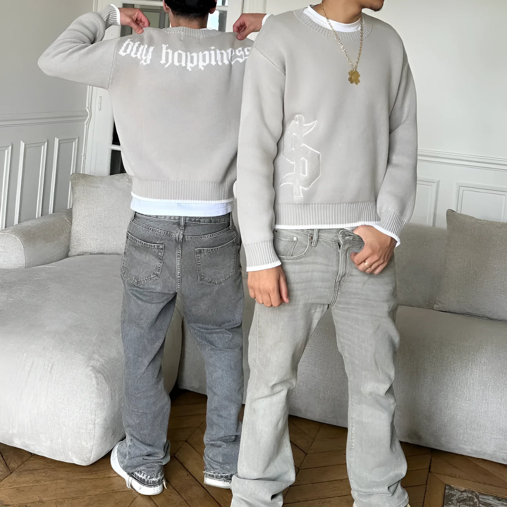 Grey loose-fit long sleeve acetate Jacquard knit pullover coat on a hanger.