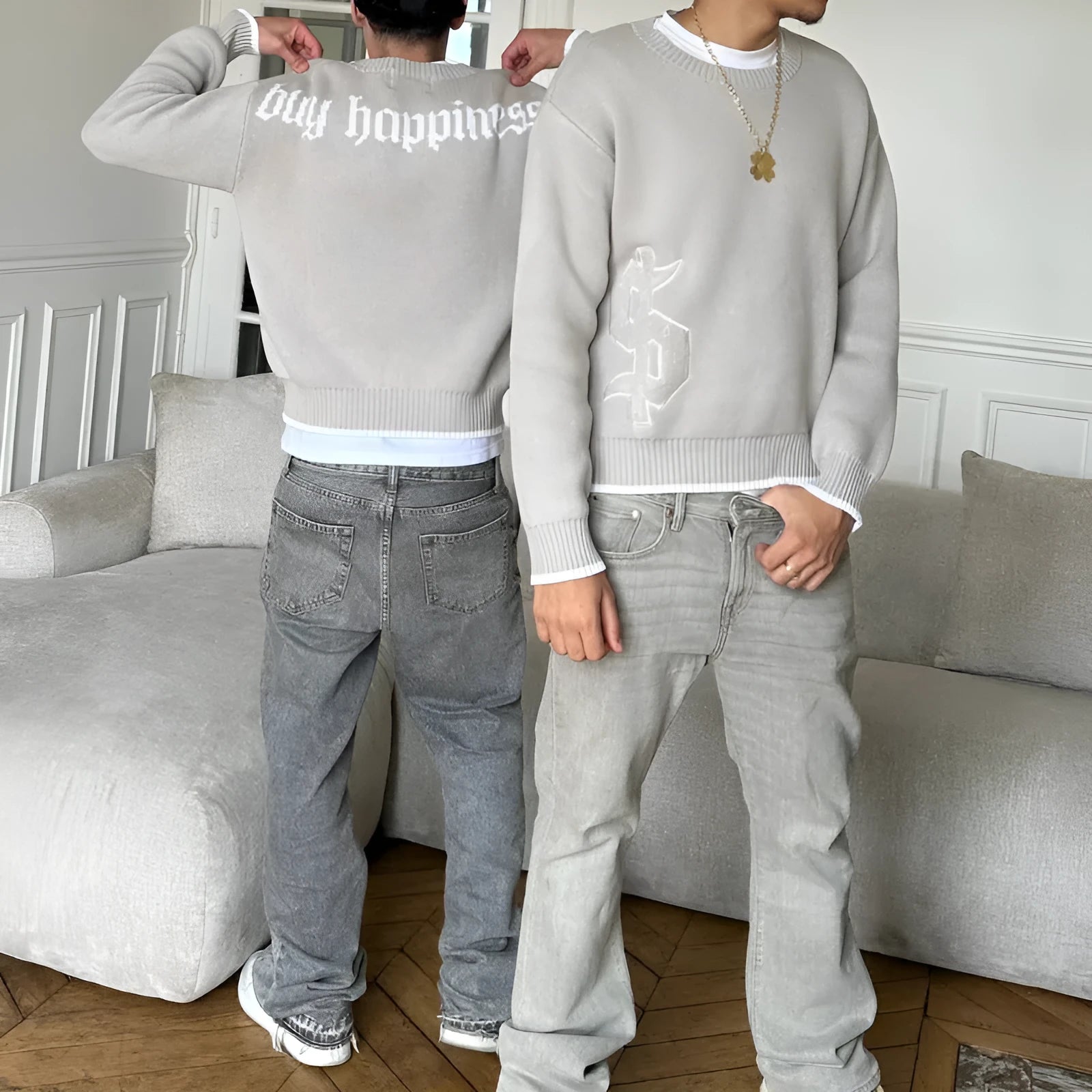 Grey loose-fit long sleeve acetate Jacquard knit pullover coat on a hanger.