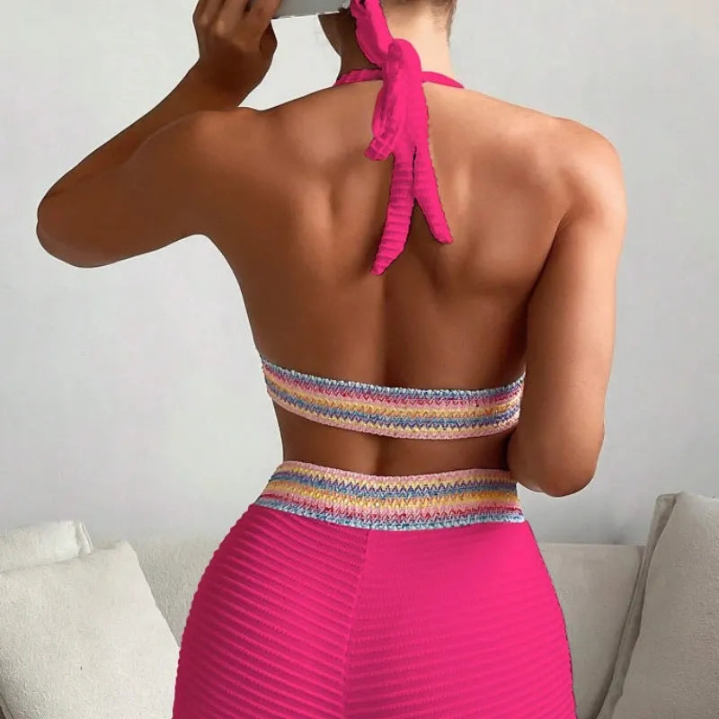 Women's high waist split leg bikini swimsuit in coral colour.