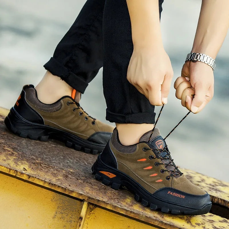 Men's brown suede mid-top hiking sneakers with a platform rubber sole and lace-up front.