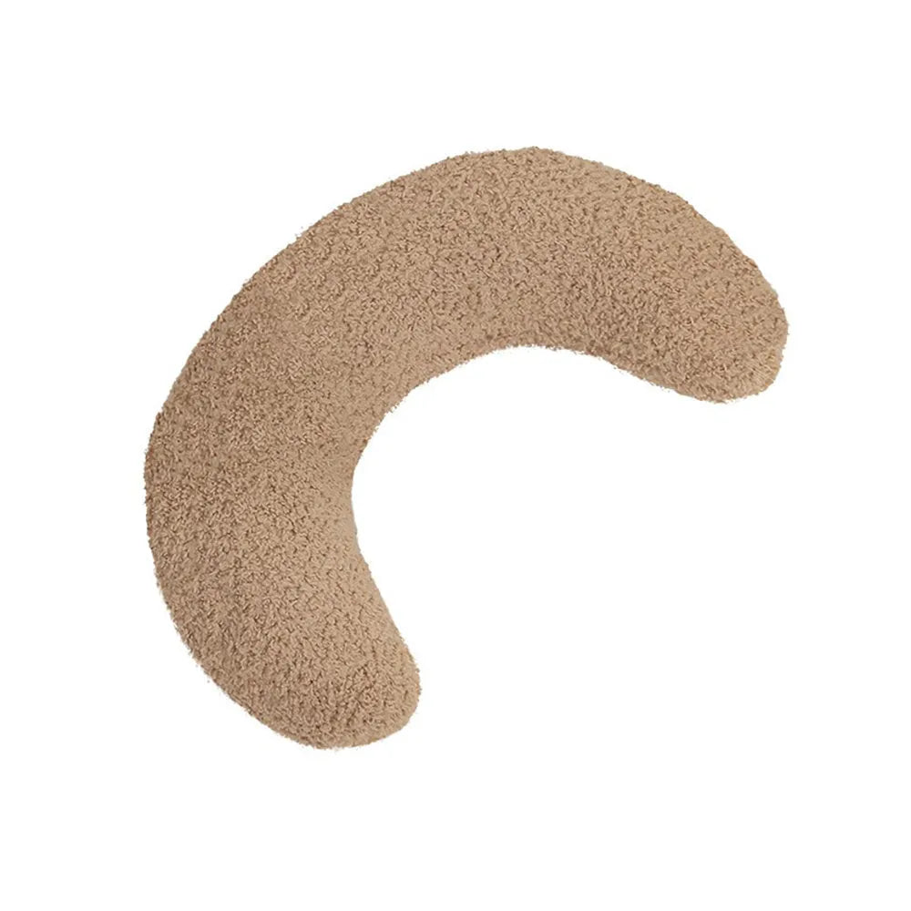 U-shaped blue cat pillow with adjustable neck collar on a sofa