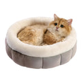 Round donut dog bed in faux rabbit fur with raised sides and anti-slip bottom, sizes XS to XL, colours blue brown green pink