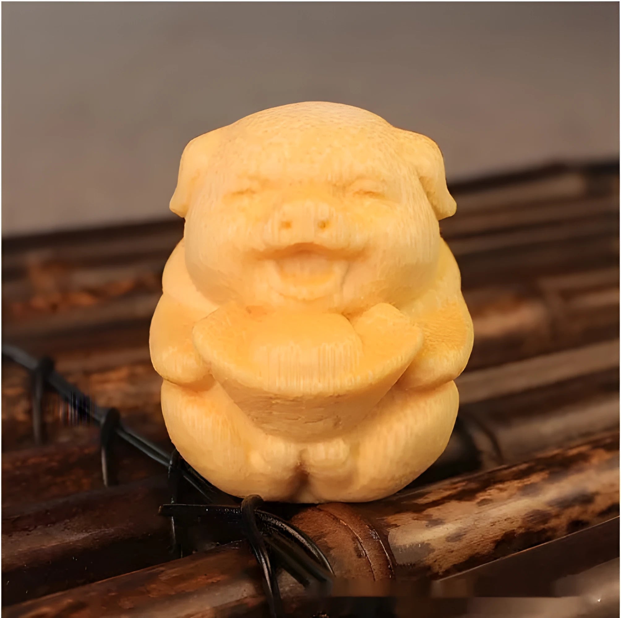 Solid bamboo carving ornament of cute pig figure measuring 4cm tall by 3.5cm diameter