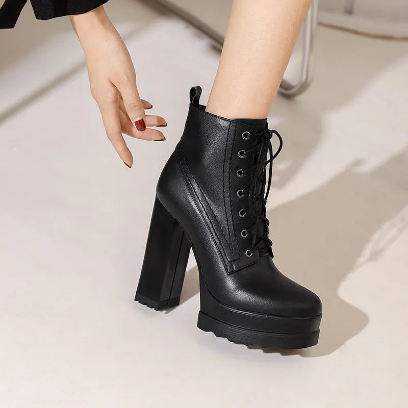Women's black waterproof platform boots with chunky heel and side zipper closure
