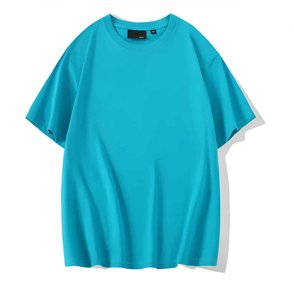 Solid colour round neck casual shirt with drop-shoulder sleeves, shown in a loose fit on a model.